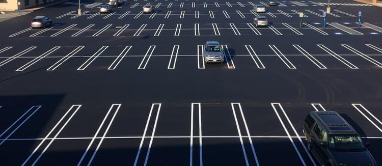 Guidelines LLC crew striping a parking lot